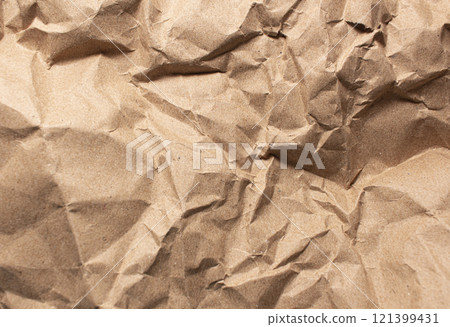 Texture of crumpled craft paper. Crumpled torn recycled background. Texture of crumpled craft paper. Crumpled torn recycled background. 121399431