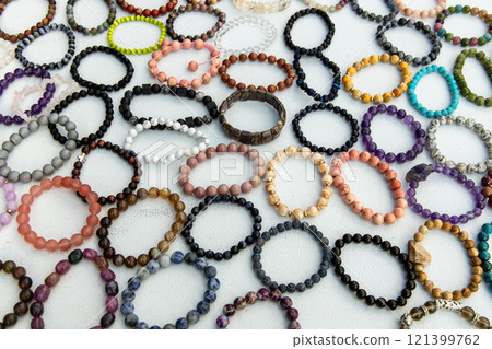 Street trade of handmade stone bracelets 121399762