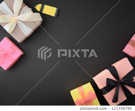Gift boxes on black paper background with copy space. AI Generated. 121399790
