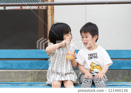 Children playing on a bench 121400136
