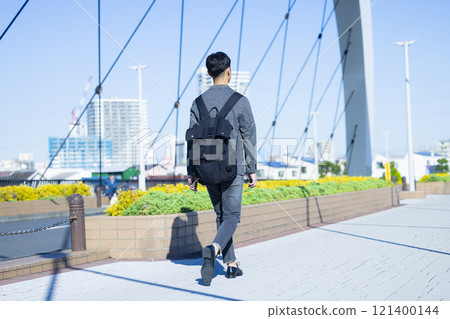 man walking outdoors 121400144