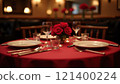 Elegant table setting with red roses for a romantic dinner 121400224