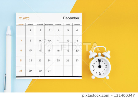 December 2025 Monthly calendar for 2025 year with pen on yellow and blue background. December 2025 Monthly calendar for 2025 year with pen on yellow and blue background. 121400347