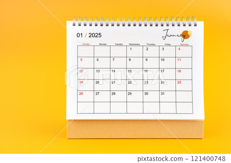 January 2025, Monthly desk calendar for 2025 year on yellow background. January 2025, Monthly desk calendar for 2025 year on yellow background. 121400748