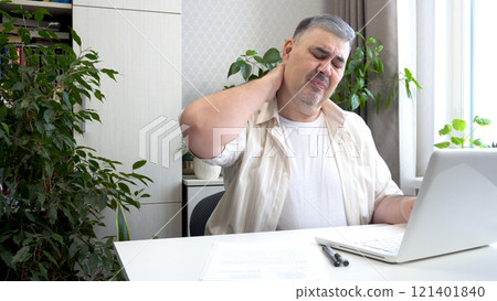 Freelancer Rubbing Neck to Relieve Discomfort from Computer Work Freelancer Rubbing Neck to Relieve Discomfort from Computer Work 121401840