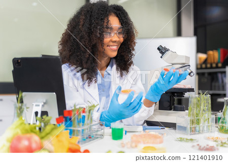 Microbiologists and nutrition experts analyze molecular samples in advanced food science labs, exploring innovations in nutrition, psychiatry, and health science research. 121401910