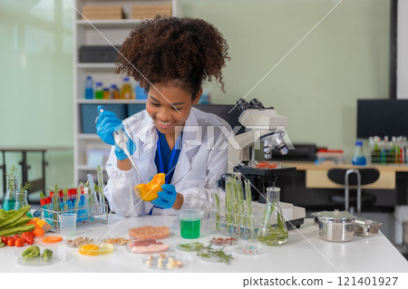 Microbiologists and nutrition experts analyze molecular samples in advanced food science labs, exploring innovations in nutrition, psychiatry, and health science research. 121401927