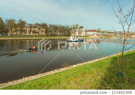 Vologda River embankment lined with low historical buildings and churches 121402309