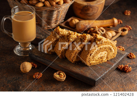 Dessert with walnuts and coffee latte on a vintage background. 121402428