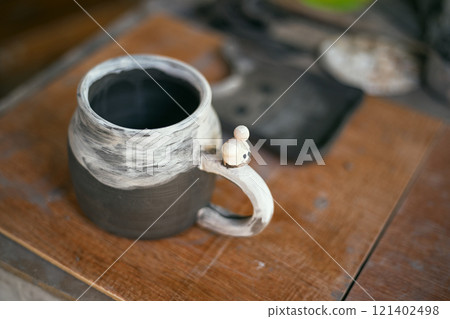 The process of creating pottery.  121402498