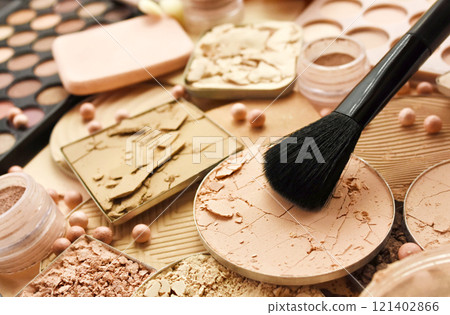 Brush with beauty cosmetics background, varieties of face powders and foundations for perfect complexion, basic make up products to even out and matte skin, selective focus, shallow DOF 121402866