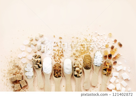 Mix of sugar varieties: unbleached, brown and white, refined and unrefined, granulated and cubes Mix of sugar varieties: unbleached, brown and white, refined and unrefined, granulated and cubes 121402872
