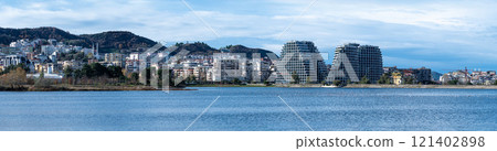 Landscape view over the city, artificial lake and park of Tirana, Albania 121402898
