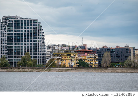 Landscape view over the city, artificial lake and park of Tirana, Albania 121402899