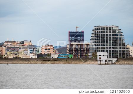 Landscape view over the city, artificial lake and park of Tirana, Albania 121402900