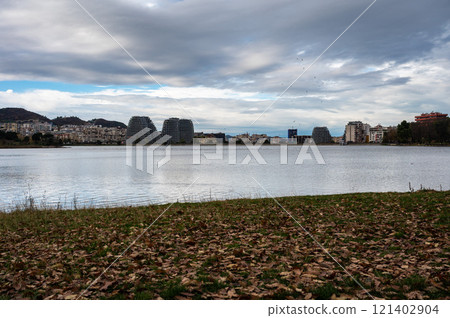 Landscape view over the city, artificial lake and park of Tirana, Albania Landscape view over the city, artificial lake and park of Tirana, Albania 121402904