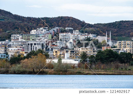 Landscape view over the city, artificial lake and park of Tirana, Albania 121402917