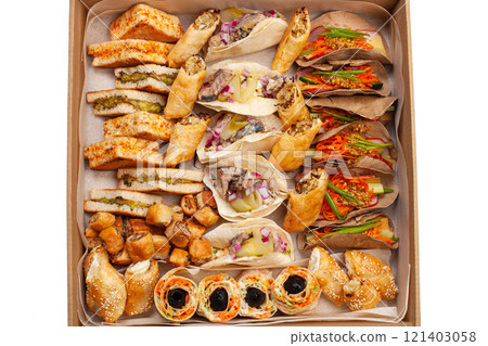 Boxing with food, cardboard box with snacks, home delivery. Catering. Gift for any holiday. Ready family dinner, party food. Boxing with food, cardboard box with snacks, home delivery. Catering. Gift for any holiday. Ready family dinner, party food. 121403058