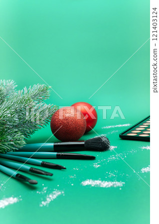 Christmas, New Year's background for make-up artist. brushes, Christmas decorations, spruce. Empty space for text. 121403124