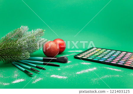 Christmas, New Year's background for make-up artist. brushes, Christmas decorations, spruce. Empty space for text. Christmas, New Year's background for make-up artist. brushes, Christmas decorations, spruce. Empty space for text. 121403125