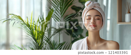 Young woman enjoying wellness treatment with eyes closed in modern bathroom Young woman enjoying wellness treatment with eyes closed in modern bathroom 121403391