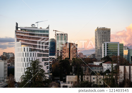 High angle view over colorful apartment blocks and mountains at dusk in the city of Tirana, Albania High angle view over colorful apartment blocks and mountains at dusk in the city of Tirana, Albania 121403545