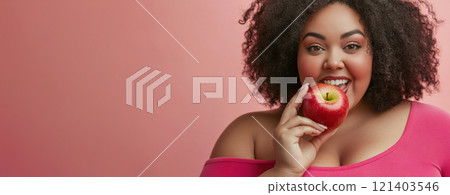 Happy plus size model eating red apple promoting healthy diet Happy plus size model eating red apple promoting healthy diet 121403546