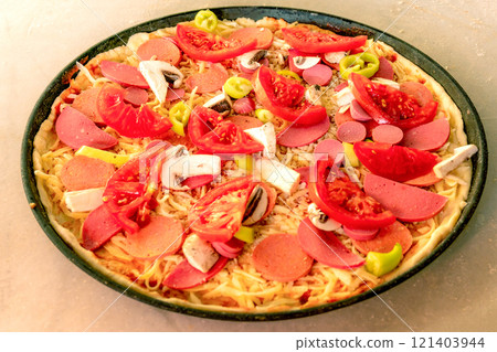 Whole Pizza on a Baking Tray. Close-up. Whole Pizza on a Baking Tray. Close-up. 121403944