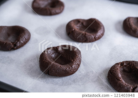 Cookie dough baked with a depression in the middle Cookie dough baked with a depression in the middle 121403948