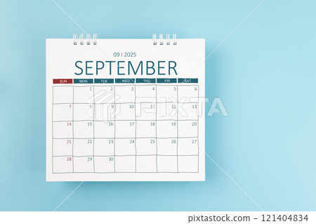 September 2025 Monthly desk calendar for 2025 year on blue color background. 121404834