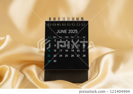 June Desk mini desk calendar black color for 2025 year on gold color silk. June Desk mini desk calendar black color for 2025 year on gold color silk. 121404994