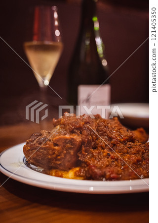 Braised lamb shank in tomato sauce Braised lamb shank in tomato sauce 121405350