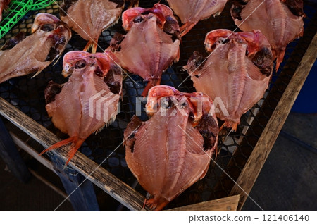 Dried fish and a fishing port scene Dried fish and a fishing port scene 121406140