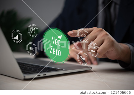 Businessman hand selecting a glowing net zero icon next to environmental symbols. Businessman hand selecting a glowing net zero icon next to environmental symbols. 121406666