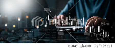 A person analyzes digital financial data and stock trends on a laptop screen. A person analyzes digital financial data and stock trends on a laptop screen. 121406701