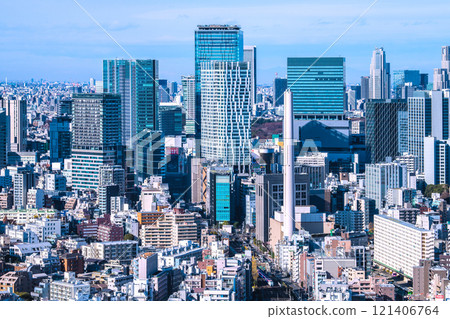 Tokyo cityscape in Japan. Shibuya office buildings. Shibuya Akush and others completed...Narita with SERIES E259 logo... 121406764