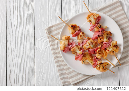spicy cauliflower kebabs with corned beef on plate 121407812