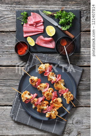 spicy cauliflower kebabs with corned beef on plate 121407814