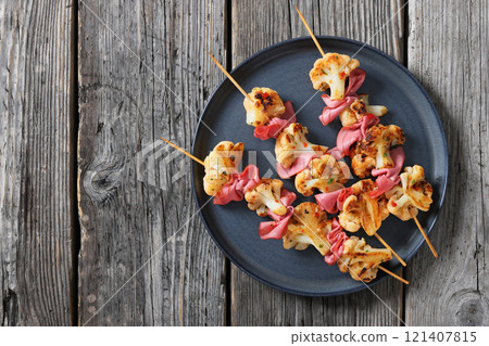 spicy cauliflower kebabs with corned beef on plate 121407815