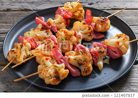 spicy cauliflower kebabs with corned beef on plate spicy cauliflower kebabs with corned beef on plate 121407817
