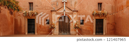 Historic Hispanic church with festival decorations, Hispanic Heritage religious, Cultural reverence 121407965