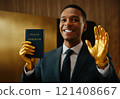 african american businessman with golden hands holding like a preacher priest the bible book of wealth workbook , simple background 121408667