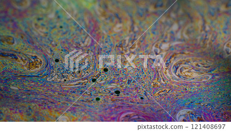 Rainbow curve. Acrylic slick. Defocused multicolor purple green liquid oil paint curve acrylic on dark black blurred light abstract art background. 121408697