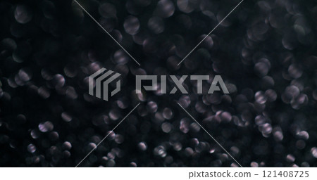 Sparkling flare. Shimmering dust. Dark background with festive silver glitter powder effect. Gentle blurred brilliance confetti magic night flashes. 121408725