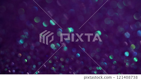 Bokeh shimmering. Dark violet. Small light flare spots of shining dust on lilac background. Blurred purple glitter fairy luminosity. Bokeh shimmering. Dark violet. Small light flare spots of shining dust on lilac background. Blurred purple glitter fairy luminosity. 121408738