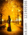 A woman taking a photo under a beautiful ginkgo tree 121409166