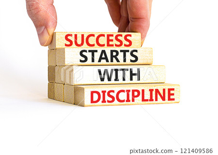 Success starts with discipline symbol. Concept words Success starts with discipline on beautiful wooden blocks. Beautiful white background. Business success starts with discipline concept. Copy space Success starts with discipline symbol. Concept words Success starts with discipline on beautiful wooden blocks. Beautiful white background. Business success starts with discipline concept. Copy space 121409586