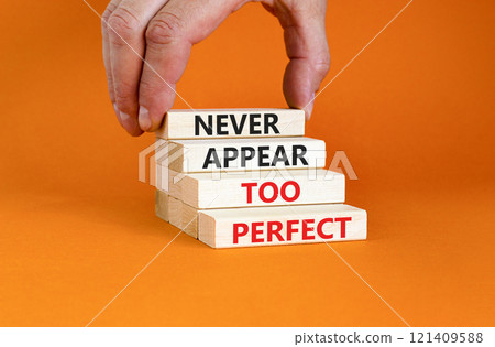 Never appear too perfect symbol. Concept words Never appear too perfect on beautiful wooden blocks. Beautiful orange table orange background. Business and never appear too perfect concept. Copy space. Never appear too perfect symbol. Concept words Never appear too perfect on beautiful wooden blocks. Beautiful orange table orange background. Business and never appear too perfect concept. Copy space. 121409588