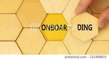 Onboarding success symbol. Concept word Onboarding on beautiful wooden puzzles. Beautiful yellow background. Businessman hand. Business onboarding success concept. Copy space. Onboarding success symbol. Concept word Onboarding on beautiful wooden puzzles. Beautiful yellow background. Businessman hand. Business onboarding success concept. Copy space. 121409635
