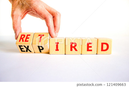Retired or expired symbol. Concept words Retired Expired on wooden cubes. Beautiful white table white background. Businessman hand. Business and retired or expired concept. Copy space. 121409663